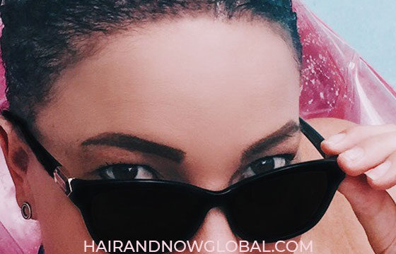 Female with Alopecia in pool showing eyebrows with makeup